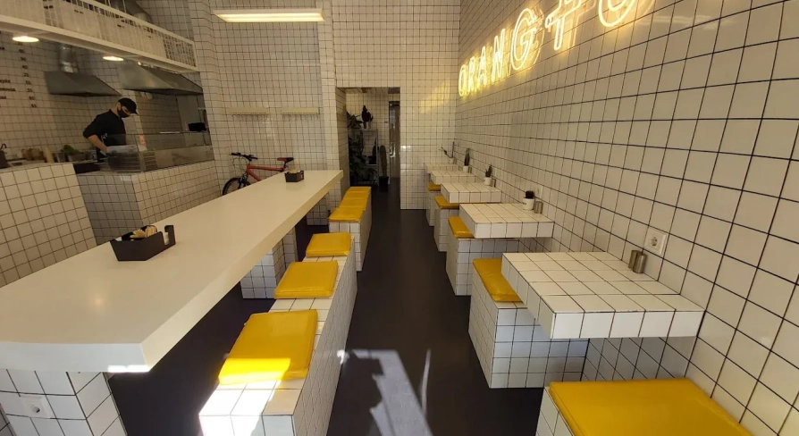 Fruit & Veg - bright interior with minimalist decor and wooden communal tables