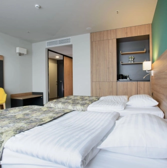 Room with two twin beds at the Favor Park Hotel in Kyiv