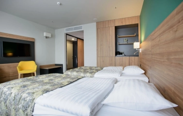 Room with two twin beds at the Favor Park Hotel in Kyiv