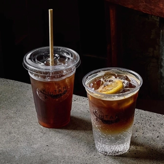 Kashtan - two iced drinks beverages in disposable cups on a counter