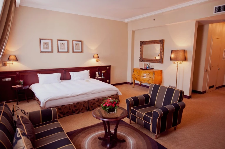 Opera Hotel - comfortable bed in a beautifully decorated room with dark wood