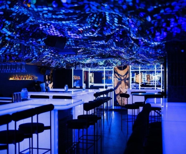 Sansara - stylish interior with mirrored walls and low hanging light fixtures