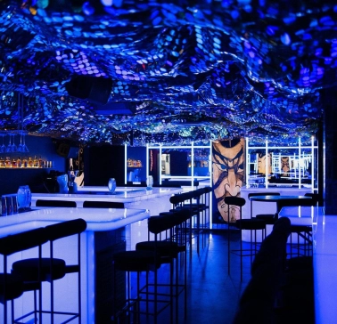 Sansara - stylish interior with mirrored walls and low hanging light fixtures