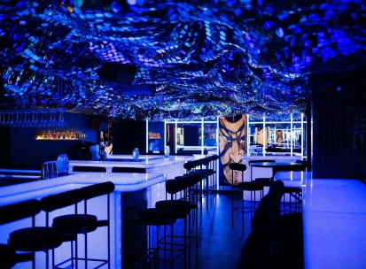 Sansara - stylish interior with mirrored walls and low hanging light fixtures