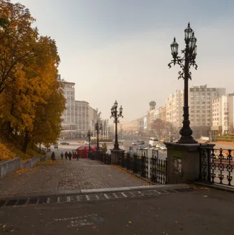 Khreshchatyi Park in Kyiv - view from the stairs with vintage lamps overlooking the city street in autumn