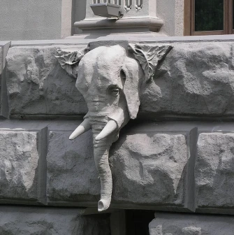 Budynok Horodetskoho in Kyiv - realistic elephant head sculpture protruding from the wall