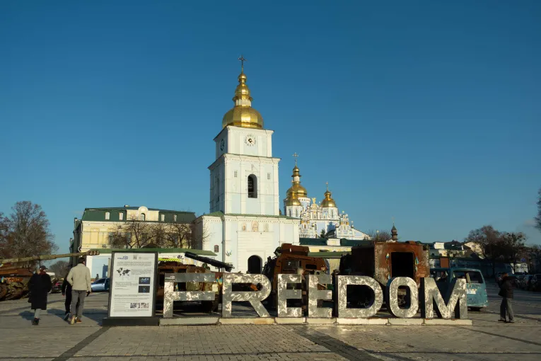St. Michael's Golden-Domed Monastery and a "FREEDOM" installation with military equipment in a square in Kyiv