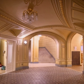 National Opera of Ukraine in Kyiv - elegant corridor with arched beige ceilings and a marble staircase leading to the balconies