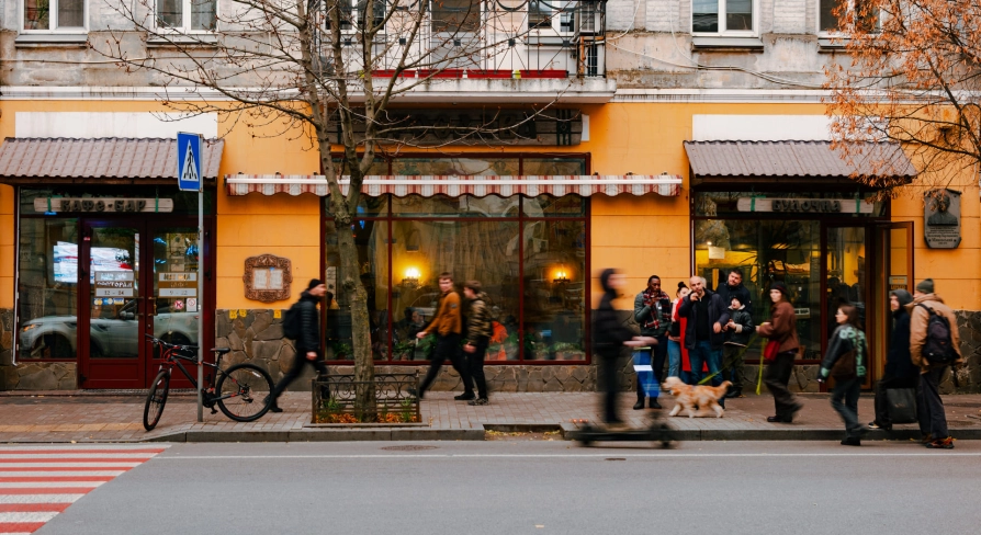 Yaroslava pastry in Kyiv - street view of the bakery on Yaroslaviv Val with people passing by