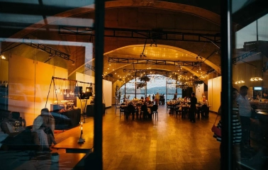 Art-Prychal - restaurant area with simple furniture and river views