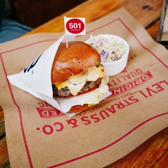 OG Burger in Kyiv - beef burger with a flag and coleslaw