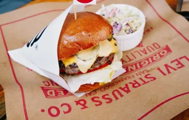 OG Burger in Kyiv - beef burger with a flag and coleslaw