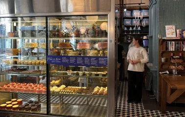 Milk Bar - dessert display with cakes and pastries in glass case