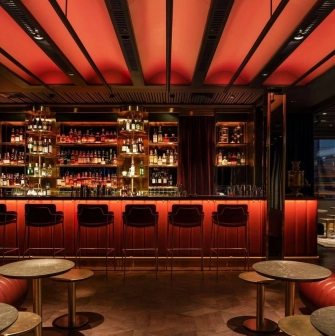 11 Mirrors - stylish hotel bar area with a long counter