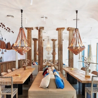 SHO - vast dining hall with high ceilings wooden paneling and impressive hanging lights