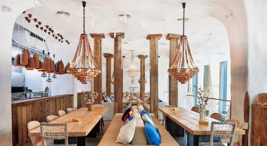 SHO - vast dining hall with high ceilings wooden paneling and impressive hanging lights