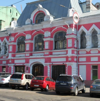 Mala Opera in Kyiv - striking historic pink and white facade of the theater featuring ornate architectural details and arched windows