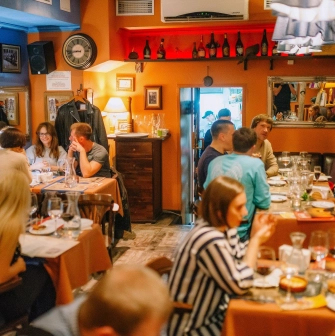 Très FRANÇAIS - elegant dining hall with chandeliers long mirrors and set tables