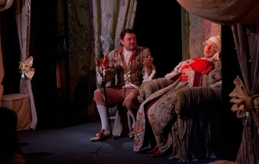 Teatr Koleso in Kyiv - theatrical scene with actors in vintage costumes performing on stage