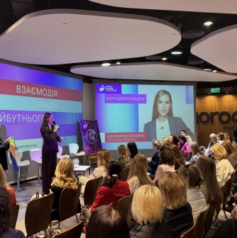 IQ Business Center in Kyiv - conference event with speaker and audience watching screens