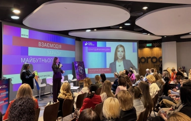 IQ Business Center in Kyiv - conference event with speaker and audience watching screens