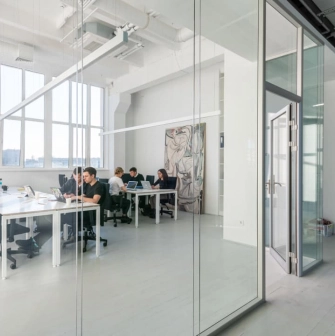 Meeting room behind a glass partition at Kooperativ in Kyiv