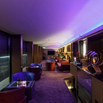 B-hush is a stylish seating area with soft seats, plants and a TV