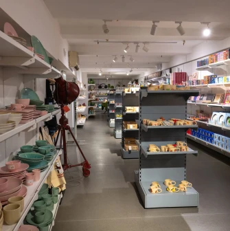 Vsi Svoi store in Kyiv - interior with shelves of Ukrainian ceramics, tableware and home decor