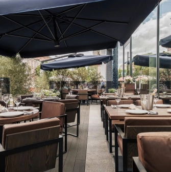 Catch Seafood Restaurant - summer terrace with umbrellas and soft sofas