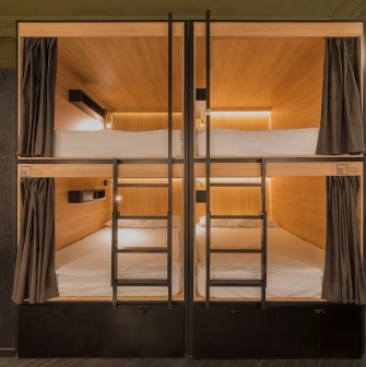 Globe Runner Hostel - dormitory room with modern capsule-style beds for privacy
