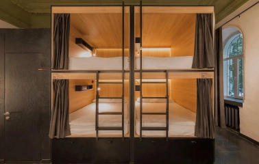 Globe Runner Hostel - dormitory room with modern capsule-style beds for privacy