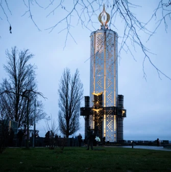 Holodomor Genocide Memorial in Kyiv with a tall candle monument