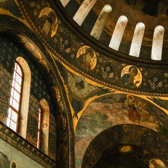 Kyiv Pechersk Lavra - interior of the Dormition Cathedral with historic frescoes and painted arches