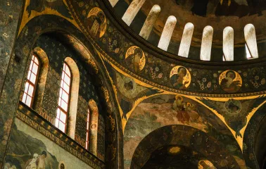 Kyiv Pechersk Lavra - interior of the Dormition Cathedral with historic frescoes and painted arches