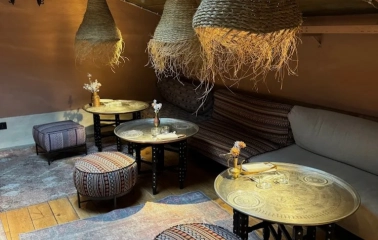 Seliam in Kyiv - attic lounge with straw lamps, low tables and poufs
