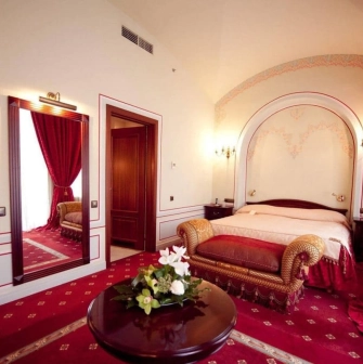 Luxury suite at Opera Hotel in Kyiv with red carpet and elegant interior