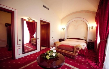 Luxury suite at Opera Hotel in Kyiv with red carpet and elegant interior