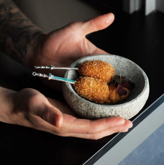 Sansara - intricately decorated snacks arranged on a plate for serving at the bar