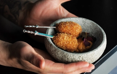 Sansara - intricately decorated snacks arranged on a plate for serving at the bar