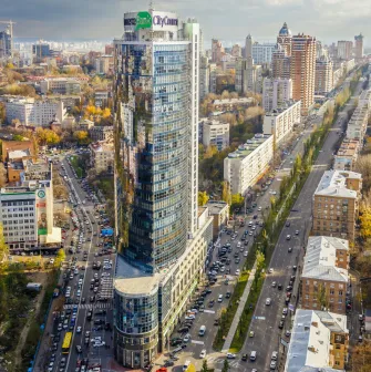Parus Business Centre in Kyiv - tall glass skyscraper rising above busy city streets
