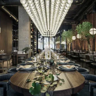 Catch Seafood Restaurant - long banquet table with leather chairs and elegant serving