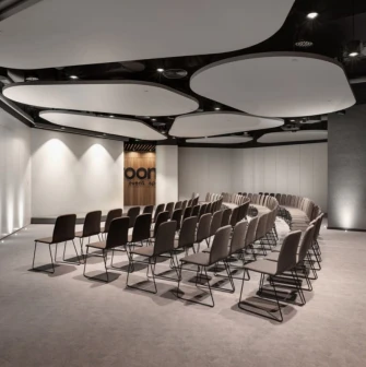 IQ Business Center in Kyiv - empty conference room with curved rows of chairs and screen