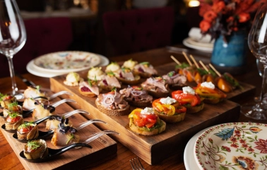 Restaurant Khutorets na Dnipri - assorted canapés and appetizers on wooden serving boards