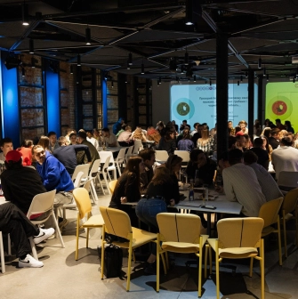 UNIT.City - bustling conference hall filled with attendees at a large event