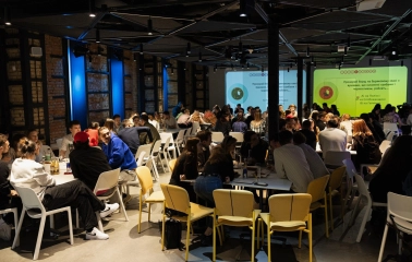 UNIT.City - bustling conference hall filled with attendees at a large event