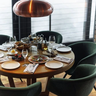 A set dining table with seafood in the interior of the "Veranda on the River" restaurant in Kyiv