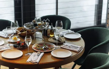A set dining table with seafood in the interior of the "Veranda on the River" restaurant in Kyiv