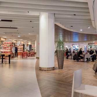 Spacious modern food court area with seating at TSUM department store in Kyiv