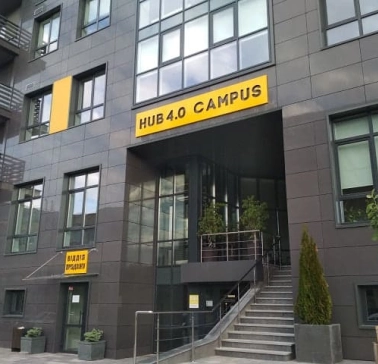 Entrance to HUB 4.0 Campus in Kyiv with a sign above the stairs
