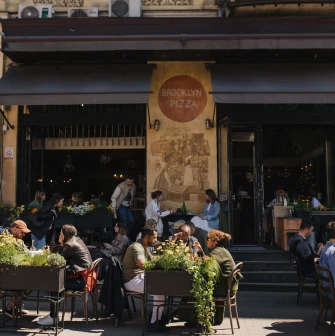 Evening entrance to the Mimosa Brooklyn Pizza restaurant in Kyiv